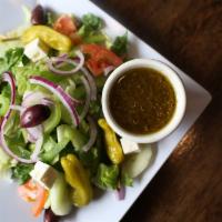Greek Salad · Romaine heart and iceberg lettuce, cucumbers, green peppers, red onions, tomatoes, pepperonc...