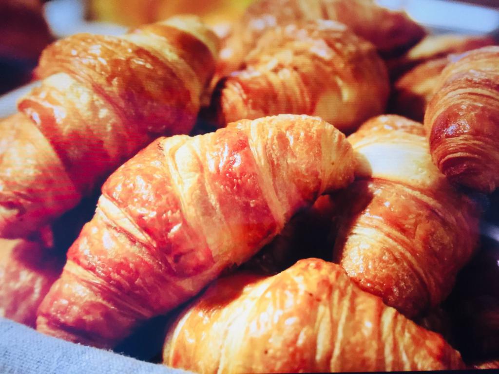 Homemade Butter Croissant · Served with nutella or strawberry or orange jam.