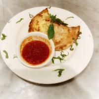 Calzone · Served with ricotta and mozzarella cheese. Add toppings for an additional charge.