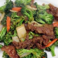 Broccoli Beef · Served with salad and rice.
