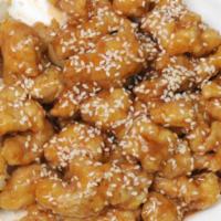Sesame Chicken · Served with salad and rice.