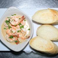 Gambas al Ajillo · Six jumbo shrimp sautéed in olive oil, garlic, white wine and parsley served with bread on t...