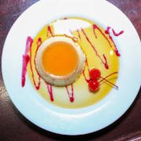 Flan · Delicious homemade custard with a touch of coconut and topped with caramel sauce and whipped...