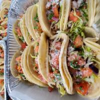Vegetarian Taco · (1) Rice and beans, lettuce, pico de gallo, Guacamole, cheese, grilled onions,peppers,green ...