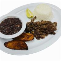 VACA FRITA · FRIED SHREDDED BEEF, WHITE RICE, BLACK BEANS TWO SWEET PLANTAINS.