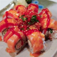 Orange Blossom Roll · Inside: tuna, shrimp tempura, crab and cucumber. Outside: salmon, albacore, spicy tuna, salm...
