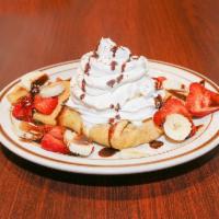 Nutella Crepes · Served with strawberries, bananas, powdered sugar, whipped cream and a scoop of vanilla bean...