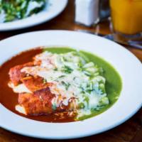 Enchiladas (2) · Soft corn tortillas smothered with our house-made green or red enchilada sauce and covered w...
