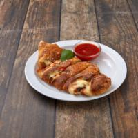 Calzone · Mozzarella and ricotta. Your choice of topping.
