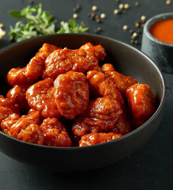Boneless Wings · Breaded all white meat chicken hand-spun with choice of signature Donatos wing sauce.