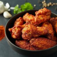 Traditional Wings · Chicken wings hand-spun with choice of signature Donatos wing sauce or dry rub.