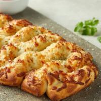 Asiago Cheese Bread · Includes choice of plain or garlic. Fresh baked artisan pull-apart bread topped with Asiago ...