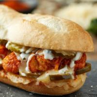 Hot Chicken Sub · Crispy hot chicken, pepper jack, jalapeno peppers, dill pickles and ranch dressing. Served o...
