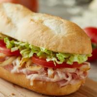 Ham and Smoked Provolone Sub · Shaved ham, smoked provolone lettuce, freshly cut Roma tomatoes and yellow onions and house ...