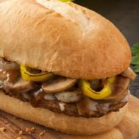 Steak Hoagie Gravy Sub · Seasoned Steak patty, smoked Provolone cheese, freshly cut yellow onions, banana peppers, fr...