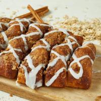 Cinnamon Bread · Fresh artisan loaf of pull-apart bread topped with sweetened cinnamon spread, streusel toppi...