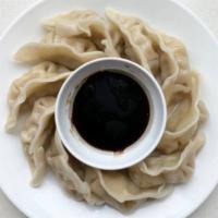 Steamed Gyoza (8 pieces) · Steamed pot stickers with pork or chicken and vegetables. Served with soy sauce.
