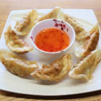  Fried Gyoza (8 pieces) · Fried pot stickers with pork or chicken and vegetables. Served with soy sauce.