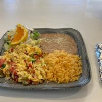 8. Huevos a la Mexicana · Scrambled eggs with onions, tomatoes and green peppers.