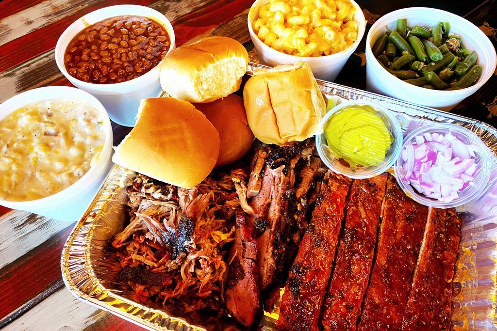 Family BBQ Meal · 3 Meats (2.5 lbs total), 4 sides, your choice of bread and sauces. Feeds 4-5 people. Must choose 3 different meats. Additional meat can be purchased by the 1/4 pound.