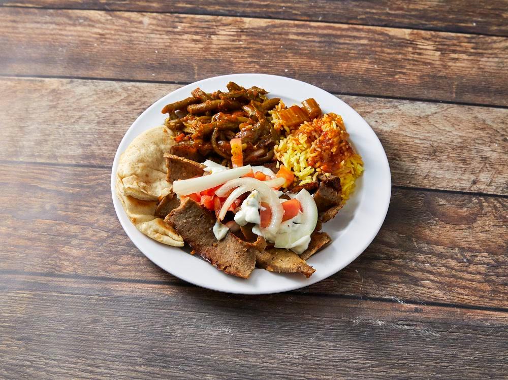 Chicken Gyro Platter · Marinated and seasoned grilled chicken breast, plated with fresh onions, tomatoes and our house made tzatziki sauce. Served with pita bread, rice pilaf and green beans.
