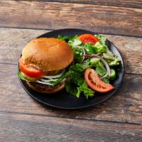 Classic Burger · Grilled Angus burger with fresh lettuce, tomatoes, onions and pickles on a grilled brioche b...
