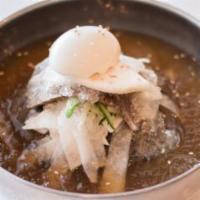 Mul Naeng Myun · Buckwheat noodles in icy-cold beef broth, garnished with pickled daikon radish, cucumber, pe...