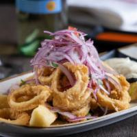 'Chicharrones' · Fried calamari rings or fish served with fried cassava, tartar sauce and 'criolla' sauce.