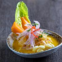 Yellow Pepper Ceviche · Fish and seafood marinated in lime juice, with onion and a yellow, pepper sauce, served with...