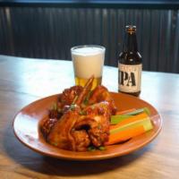 BUFFALO WINGS · FRIED, TOSSED IN A BUFFALO SAUCE, AND CHAR GRILLED, SERVED WITH CARROTS AND CELERY