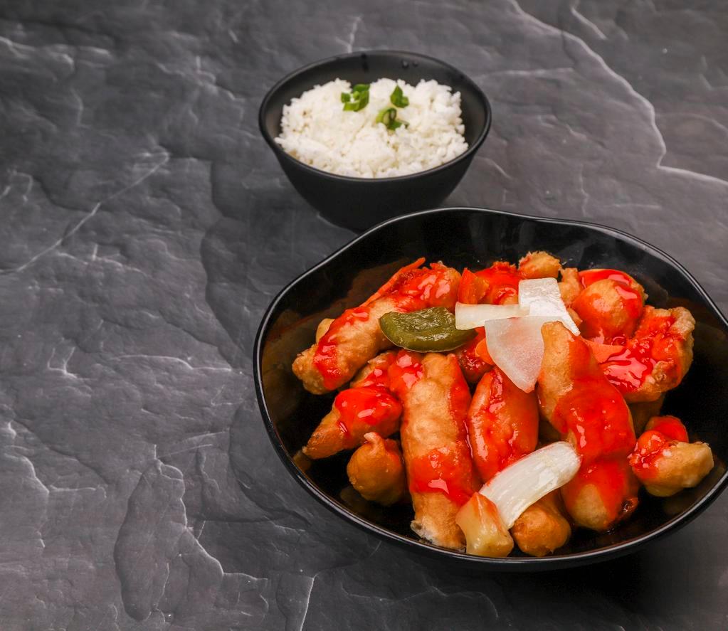 C06. Sweet and Sour Chicken · Pineapple, carrot, bell pepper and onion. Served with white rice.