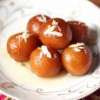 Gulab Jamun · Deep fried milk balls soaked in saffron flavored syrup.