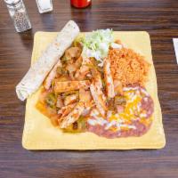 Chicken Ranchero Special · Chicken simmered in tomatoes, onions and chilis. Served with rice and beans. Served with ric...