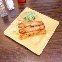 Side Beef Taquitos · 3 crispy taquitos with guacamole.