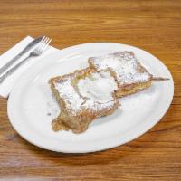 Cinnamon Revolution French Toast · Browned bread with cinnamon and sugar.