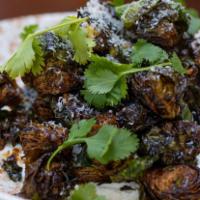 Crispy Sprouts · Fried Brussels Sprouts, Cotija cheese, lime, Creme Fraiche