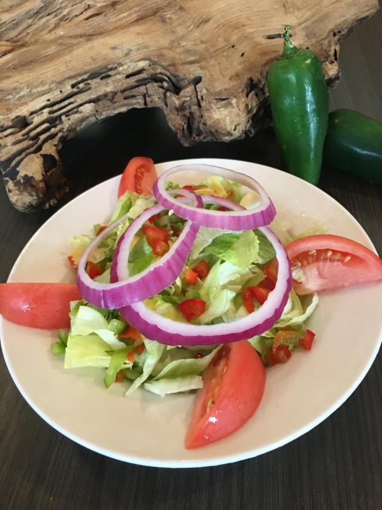 House Salad · Iceberg and romaine with cheddar cheese, tomato, cucumber, red onion, and croutons. Served with your choice of ranch, vinaigrette, Caesar, chunky blue cheese, or honey mustard.