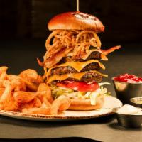 Texas Bacon Triple Stack (3/4 lb) · Cheddar, American, and pepper Jack cheese with fried onion strings. Served with tornado fries.