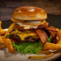 Brunch Burger · Served with American cheese, country sausage, thick cut bacon, a fried egg, lettuce, tomato ...