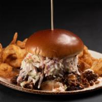 Pulled Pork Sandwich · Slow cooked pork in our special BBQ sauce topped with coleslaw. Served with tornado fries.