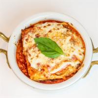 Lasagna Emiliana · Housemade lasagna sheets, ragù alla Bolognese, besciamella, Parmigiano Reggiano DOP (Contain...