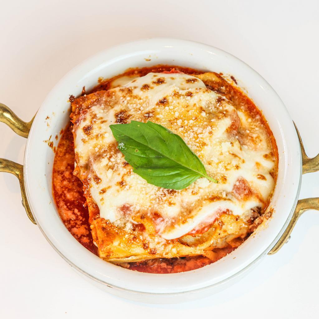 Classic Lasagna · Housemade Lasagna Sheets, Beef and Pork Ragu, Besciamell, Parmigiano Reggiano