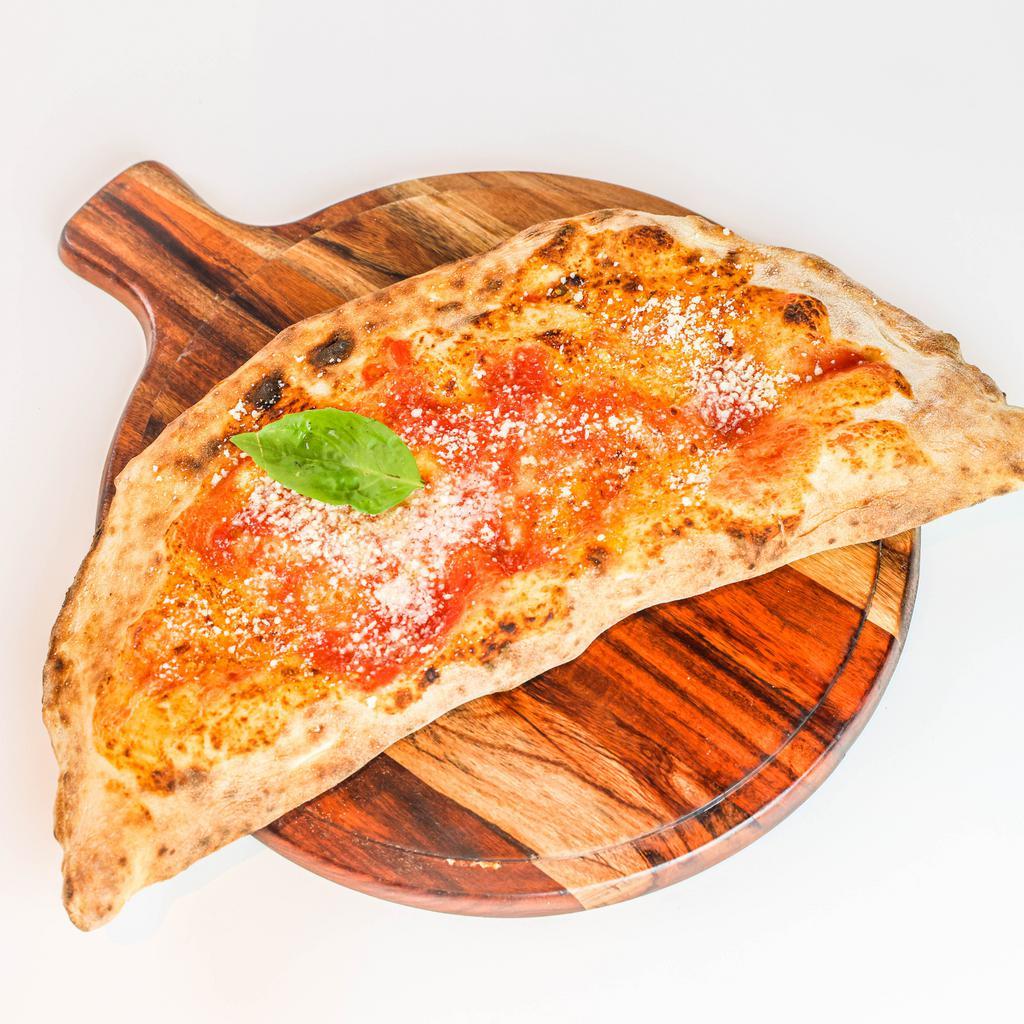 Calzone Classico · San Marzano Tomato Sauce, Buffalo Mozzarella, Ricotta, Rovagnati Granbiscotto Ham, Fresh Basil, Extra Virgin Olive Oil