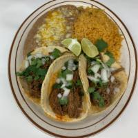 Barbacoa taco plate  · 3 barbacoa tacos served on a handmade tortilla with cilantro and onions. Served with rice an...