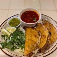 Quesabirria tacos with consome  · 4 quesabirrias tacos with consome to dip in. Served with cilantro, onions and lime on the si...