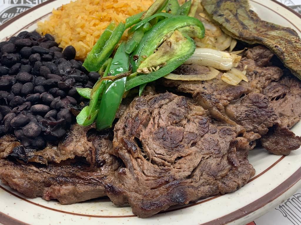 Carne parrillada  · Grilled thin ribeye steak served with black beans, rice, grilled onions, Mexican cactus and jalapeños. 