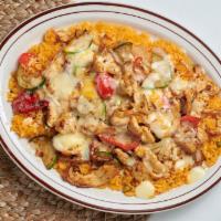 Arroz con Pollo · Chicken strips cooked to perfection with squash, bell peppers and onions, then placed on top...