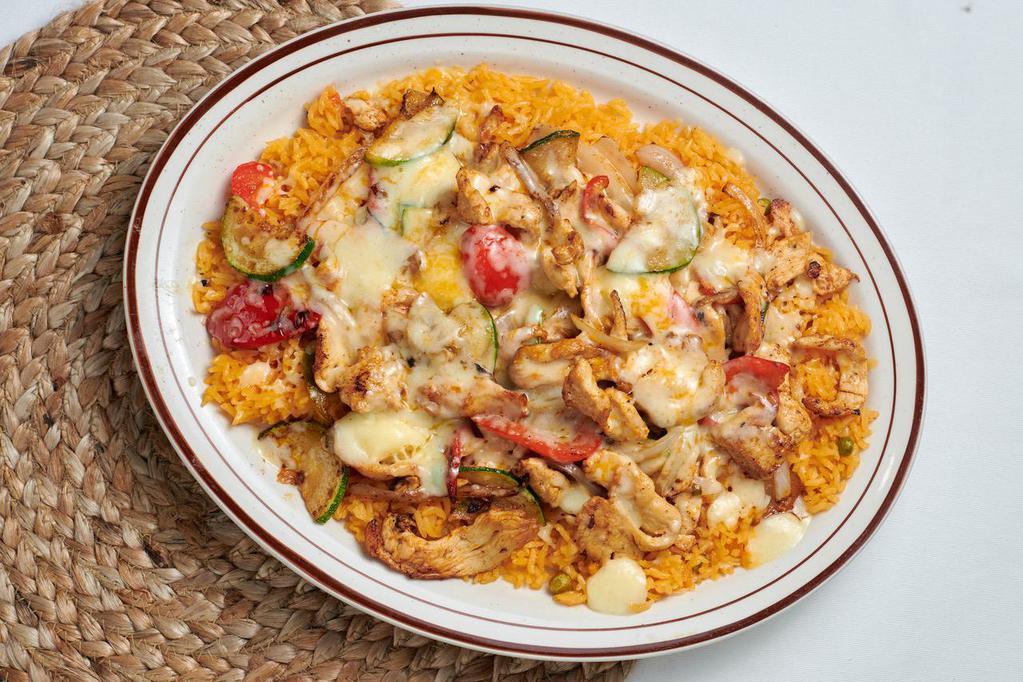 Arroz con Pollo · Chicken strips cooked to perfection with squash, bell peppers and onions, then placed on top of a bed of rice, topped with melted cheese. Served with tortillas.