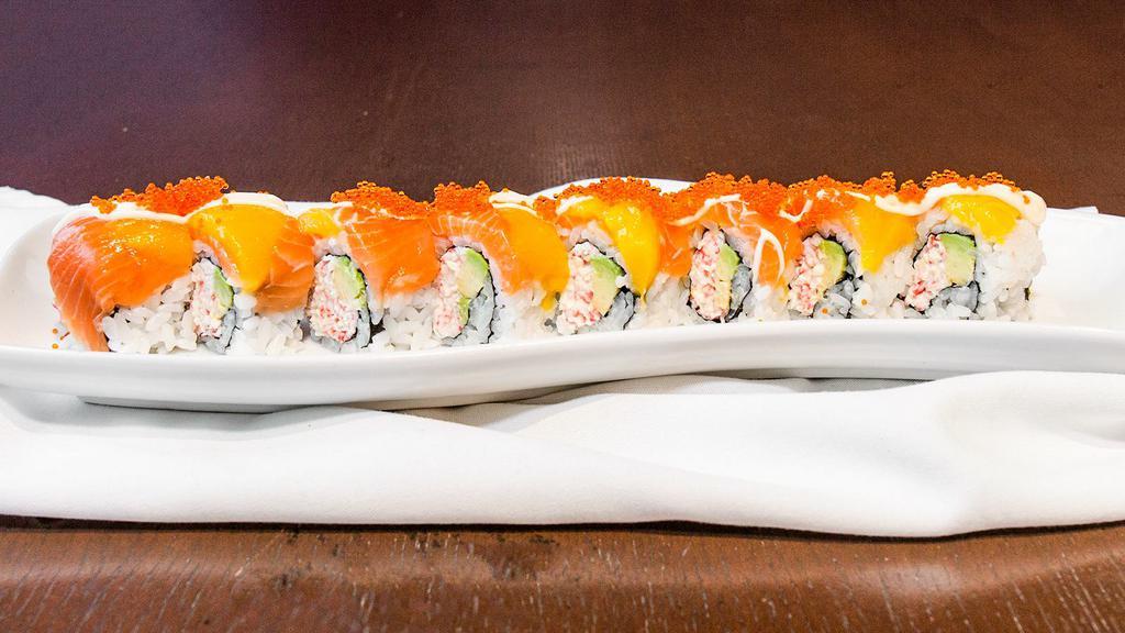 Gold Mine Roll · Crab meat, avocado, mango, tobiko, and salmon with mayonnaise sauce.
