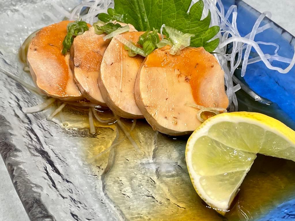 Ankimo Sashimi (4 PCS) · Ankimo is a Japanese dish made with monkfish liver. The liver is first rubbed with salt, then rinsed with sake. Then its veins are picked out and the liver is rolled into a cylinder and steamed. 4 PCS sliced with scallions and ponzu sauce.